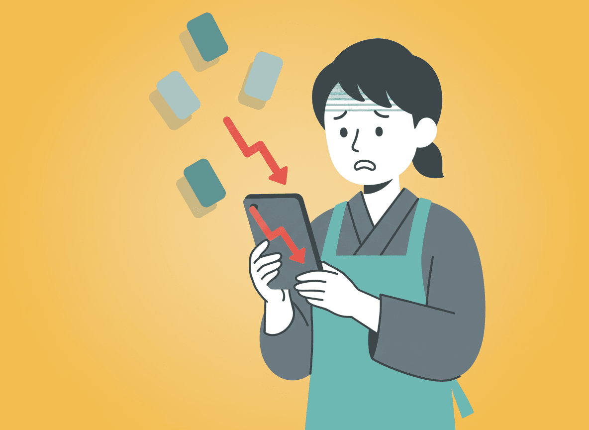 タブレットに表示された下向きの赤い矢印を見て困った表情を浮かべる、エプロン姿の店主のイラスト